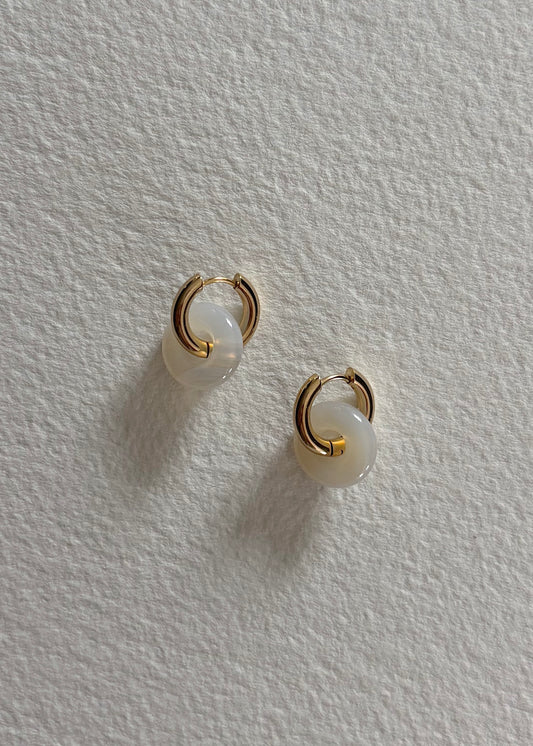 Gold hoops earrings with semi-precious stone. Modern and minimalist design to wear everyday.