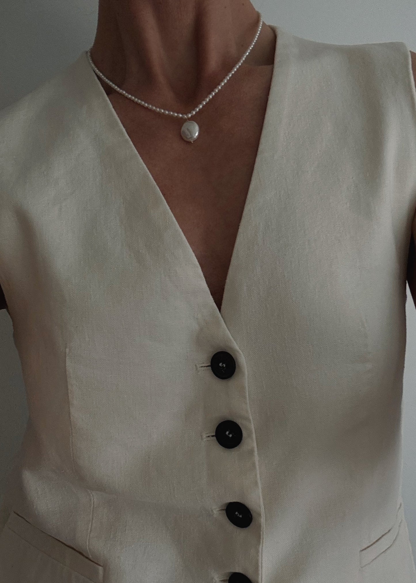 Hand-knotted freshwater pearl necklace on white silk thread with pearl pendant featuring timeless minimalist elegance for women