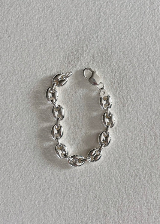     Close-up of a sterling silver bracelet. High shine and bold design to elevate your style.