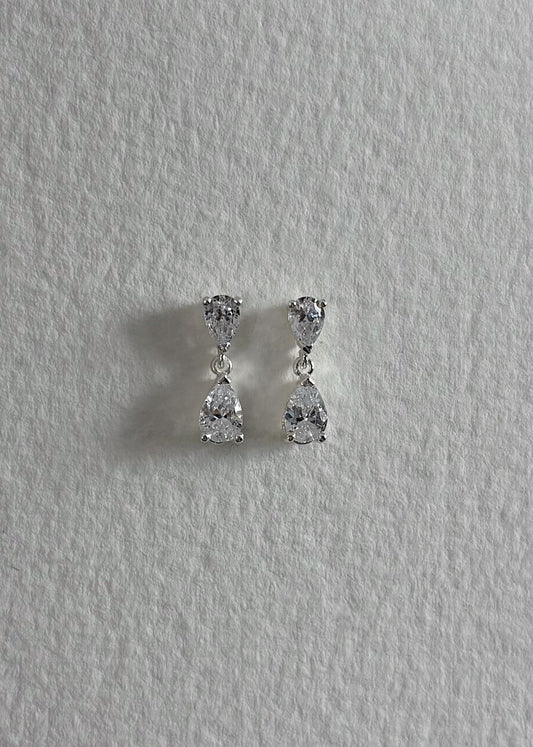 Silver earrings crafted in 925 sterling silver, adorned with semi-precious stones, featuring a timeless design that reflects soft elegance and subtle, luminous shine.