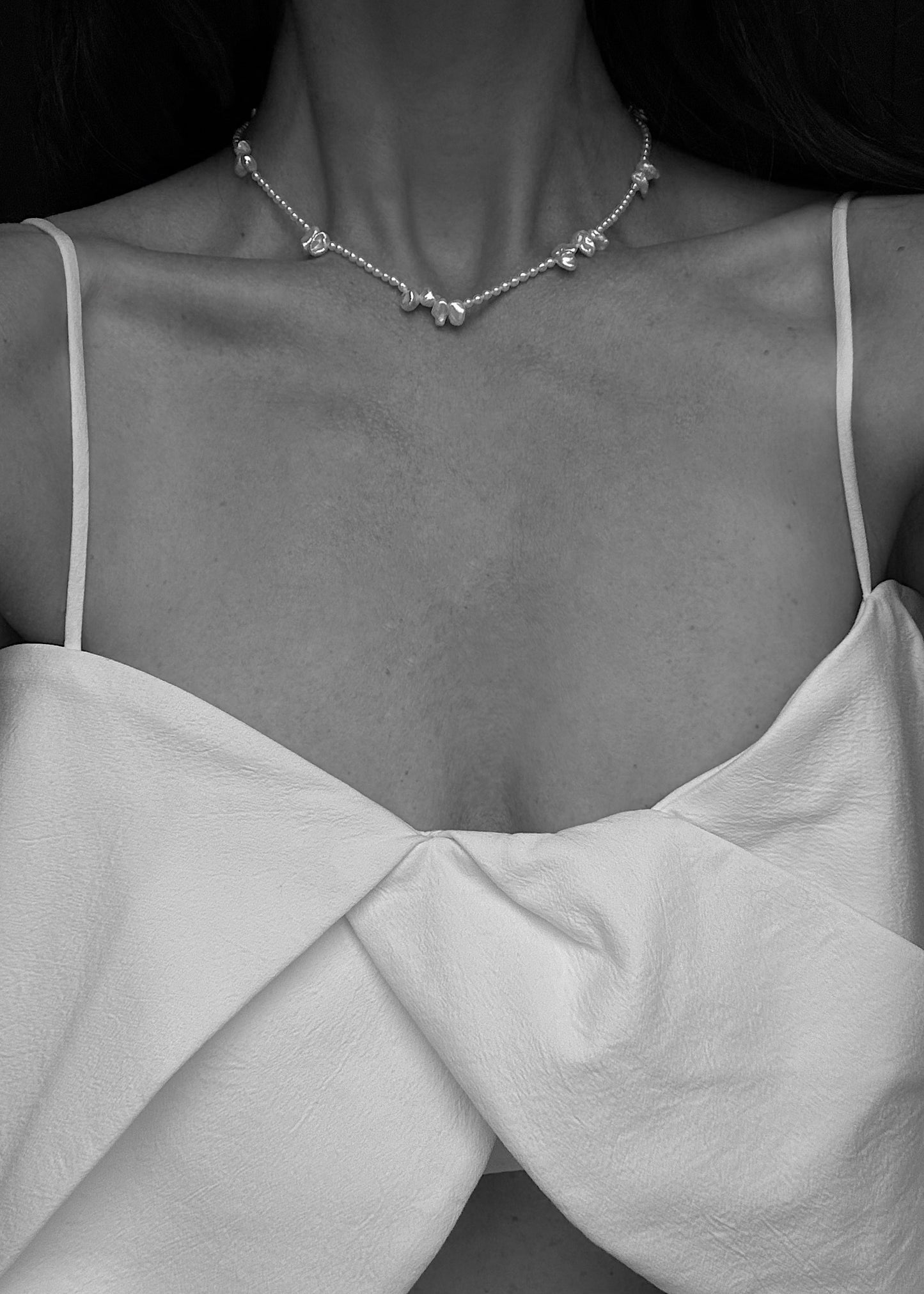 Minimalist freshwater pearl necklace styled for everyday wear.