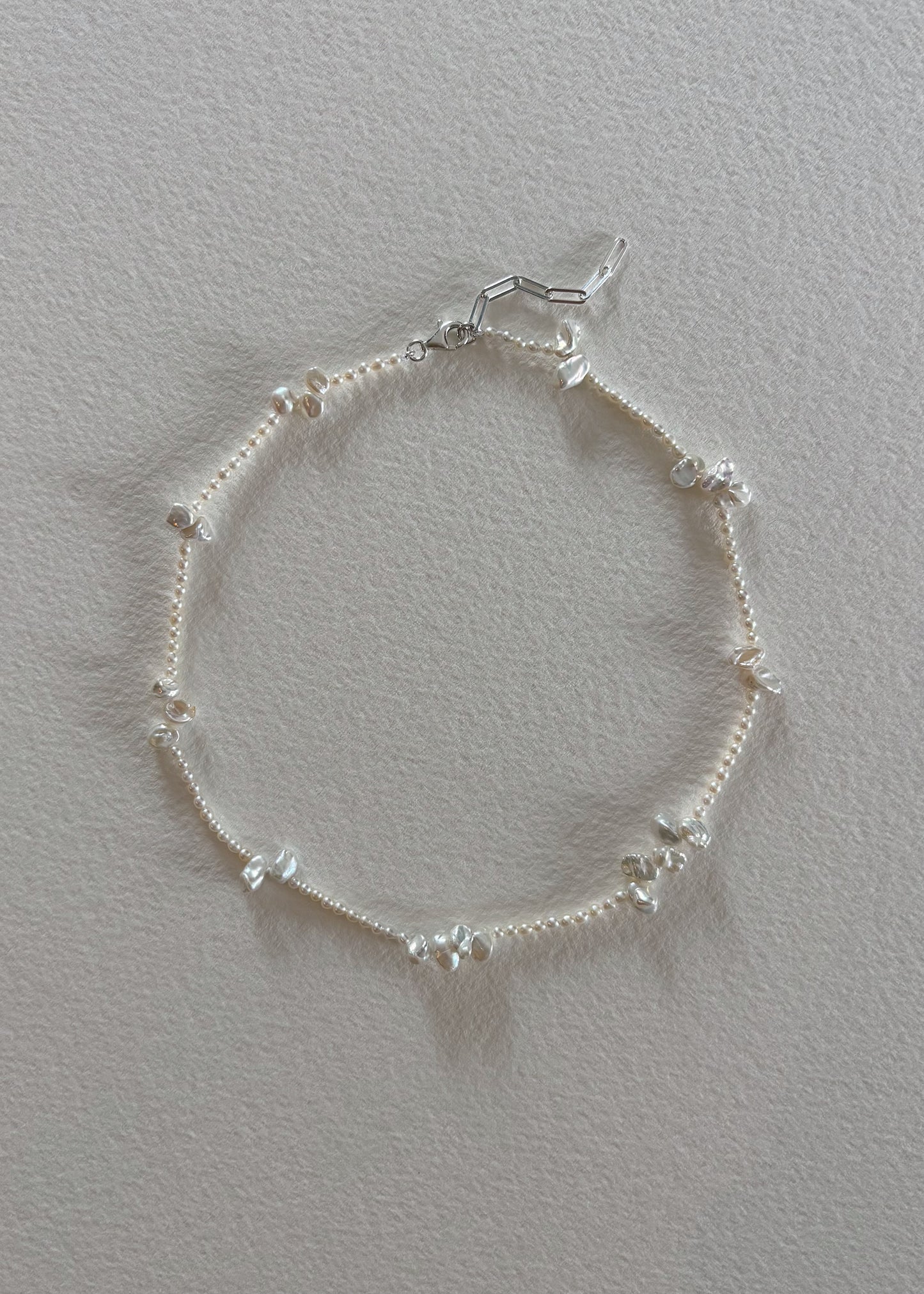     Elegant sterling silver 925 freshwater pearl necklace with a minimalist design.