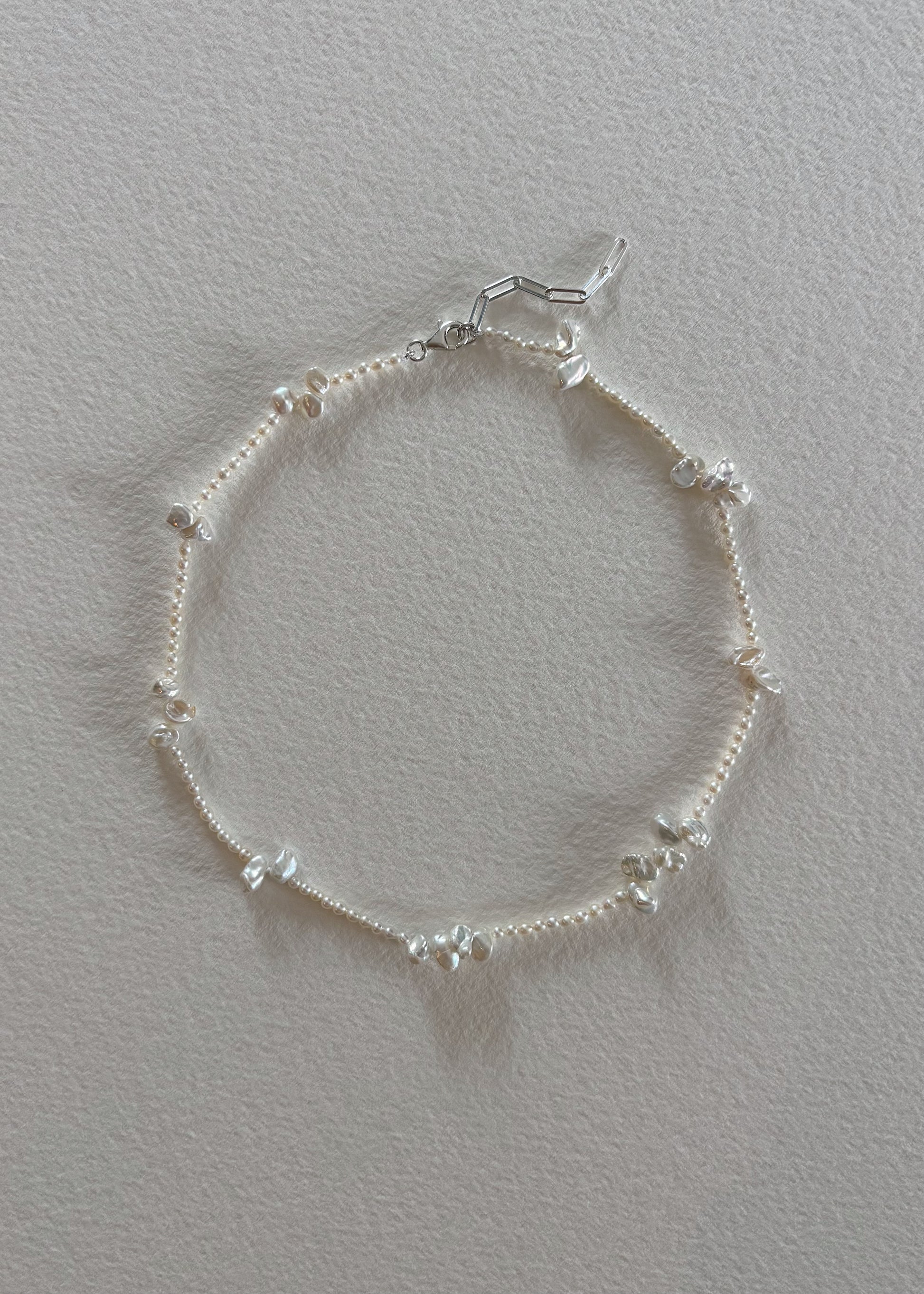     Elegant sterling silver 925 freshwater pearl necklace with a minimalist design.